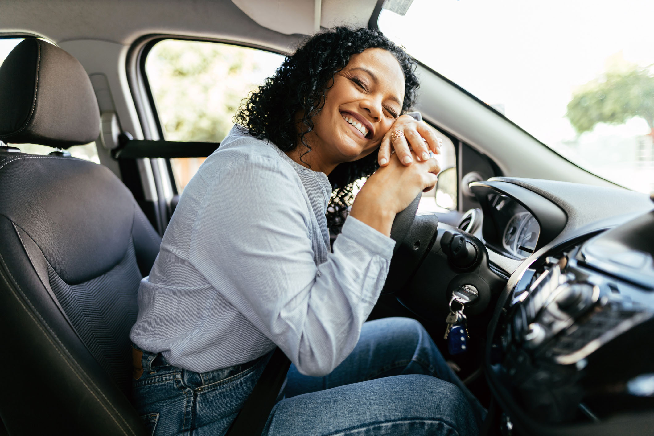 Person happy in new car